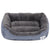 An Anything Pets gray dog bed with a paw print on it.